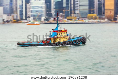 tug boat cruising Victoria harbor