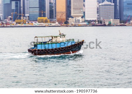 VICTORIA, HONG KONG - JANUARY 8 : Ship cruising Victoria harbor on January 8, 2010 in Hong Kong, China. The Central area on the island is the historical, political and economic centre of Hong Kong