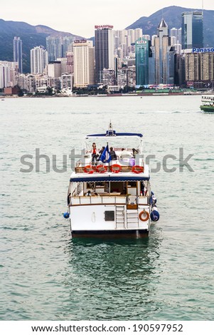 VICTORIA, HONG KONG - JAN 8 : Ship with party guests cruising Victoria harbor on January 8, 2010 in Hong Kong, China. The Central area on the island is the  political and economic centre of Hong Kong.