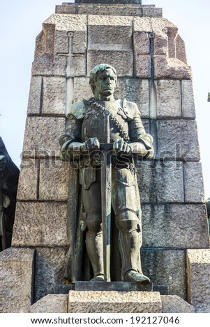 KRAKOW, POLAND - SEPTEMBER 5: A figure of a defeated knight on the monument dedicated to the battle of Grunwald on Sep 5, 2014 in Old town of Krakow, Poland.