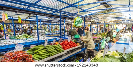 KRAKOW, POLAND - MAY 5, 2014: people sell their goods at the market Stary Kleparz on May 5, 2014 in Krakow, Poland. The covered marketplace has a tradition over 800 years.