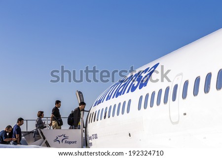 FRANKFURT, GERMANY - MAY 4: people board the Lufthansa aircraft on May 4, 2014 in Frankfurt, Germany. Frankfurt is  the busiest airport in Germany and one of the busiest in Europe.
