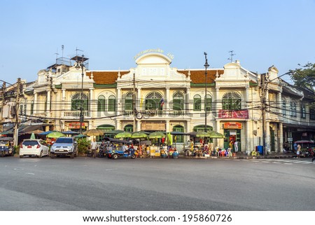 BANGKOK, THAILAND - JANUARY 4, 2010: building of the siam city bank with exchange counter in an old victorian building with people at the street market in front, Bangkok, Thailand.