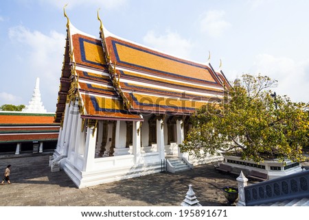 BANGKOK, THAILAND - JANUARY 4, 2010: people visit Phra Sri Ratana Chedi in the Grand palace, Bangkok, Thailand. Grand Palace is Thailands most important and sacred temple area.