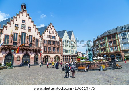 FRANKFURT, GERMANY - JUNE 3, 2014: People on Roemerberg square in Frankfurt, Germany. Frankfurt is the fifth-largest city in Germany, with a population of 687,775.