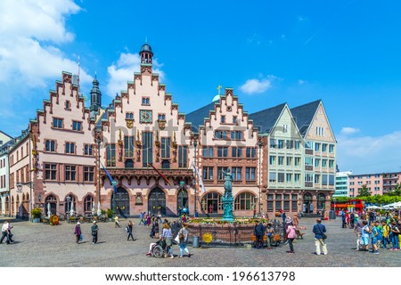FRANKFURT, GERMANY - JUNE 3, 2014: People on Roemerberg square in Frankfurt, Germany. Frankfurt is the fifth-largest city in Germany, with a population of 687,775.