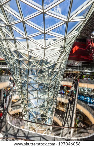 FRANKFURT, GERMANY - AUGUST 21, 2010: people visit and shop inside the myZeil center in Frankfurt, Germany. The modern building by architect Fuksas was inaugurated in 2009.