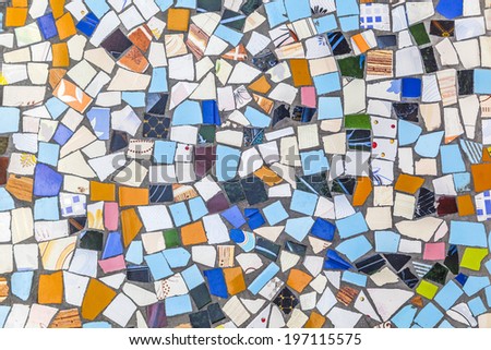broken tiles are reused for a floor in India