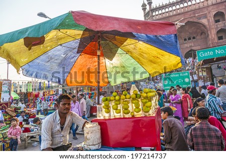 DELHI - NOVEMBER 8, 2011: man sells lemon drinks  at the Meena Bazaar Market in Delhi, India. Shah Jahan founded the bazaar in the 17th century inspired by the architecture of the Isfahan Bazaar.