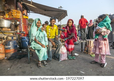 DELHI - NOVEMBER 8, 2011: women relax at a tea shop at the Meena Bazaar Market in Delhi, India. Shah Jahan founded the bazaar in the 17th century inspired by the architecture of the Isfahan Bazaar.