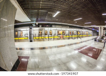 DELHI, INDIA - NOV 10, 2011: people leave the metro station  in Delhi, India. It is one of the largest metro networks in the world. The network consists of six lines with 142 Stations.