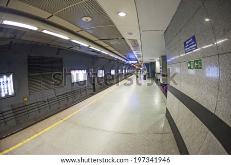 DELHI, INDIA - NOV 10, 2011: people leave the metro station  in Delhi, India. It is one of the largest metro networks in the world. The network consists of six lines with 142 Stations.