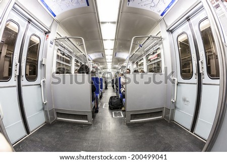FRANKFURT, GERMANY - MAR 18, 2010: people in the local train Line S3 in Frankfurt, Germany. Frankfurt public transport system is operated by the company RMV. S3 serves the area Frankfurt to Bad Soden.
