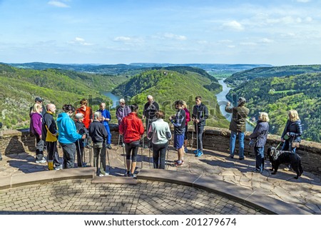 CLOEF, GERMANY - APRIL 29, 2013: people enjoy the spectacular view  to Saar loop at Cloef, Germany. The scenic spot was built in 1856 and is the most famous saar view spot in the Saarland.