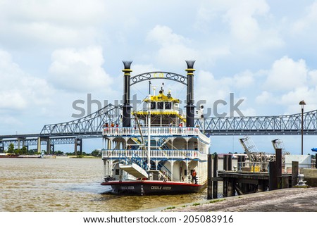 NEW ORLEANS - JULY 16, 2013: people at the creole Queen steam boat in New Orleans, USA. Constructed in Moss Point, Mississippi, the Creole Queen took her maiden voyage on October 1, 1983.
