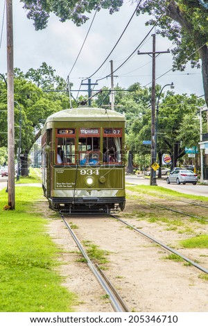 NEW ORLEANS - JULY 16, 2013: famous old Street car St. Charles line in New Orleans, USA. It is the oldest continually operating street car line in the world.