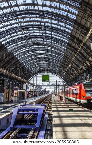 FRANKFURT, GERMANY - JULY 19, 2014: people Inside the Frankfurt central station in Frankfurt, Germany. With about 350.000 passengers per day its the most frequented railway station in Germany.