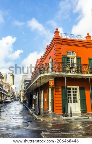 NEW ORLEANS,  USA - JULY 17, 2013: people visit historic building in the French Quarter in New Orleans, USA. Tourism provides a large source of revenue after the 2005 devastation of Hurricane Katrina.