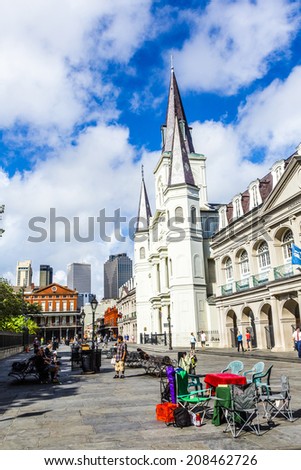 NEW ORLEANS, LOUISIANA USA - JULY 17, 2013:  St. Louis cathedral in the French Quarter in New Orleans, USA. Tourism provides a large source of revenue after the 2005 devastation of Hurricane Katrina.