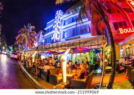 MIAMI, USA - AUG 19, 2014: people enjoy Ocean drive nightlife in  Miami, USA. Art Deco district architecture is one of the main tourist attractions in Miami.