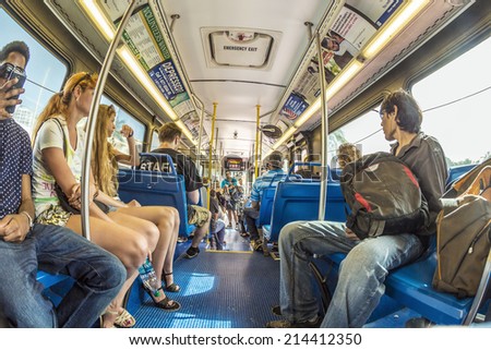 MIAMI, USA - AUG 18, 2014: people in the downtown Metro bus in Miami, USA. Metrobus operates more than 90 routes with close to 1,000 buses covering 41 million miles per year.
