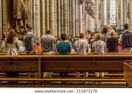 COLOGNE, GERMANY- SEP 7, 2014: church service held in the cathedral in Cologne, Germany. The dome is Germanys most visited landmark visited by 20.000 people a day.