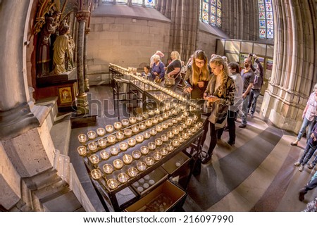 COLOGNE, GERMANY- SEPTEMBER 7, 2014: church service held in the cathedral in Cologne, Germany. The dome is Germanys most visited landmark visited by 20.000 people a day.
