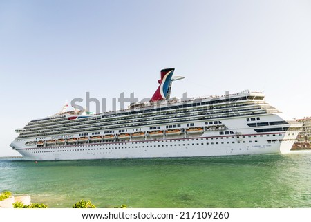 MIAMI, USA - AUGUST 18, 2014: Carnival Cruise Line, cruise ship Carnival Victory Sails from Miami, USA to a cruise in the Carribean.