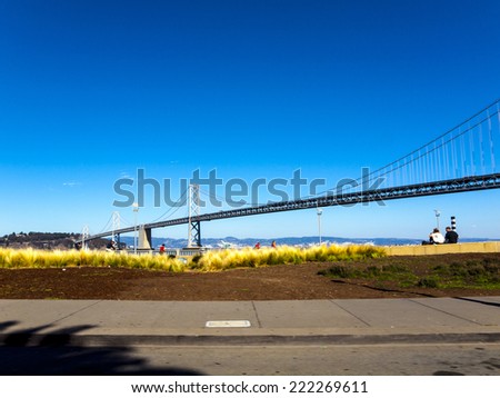 SAN FRANCISCO, USA - SEP 18, 2014: people enjoy view to Bay Bridge in San Francisco, USA.