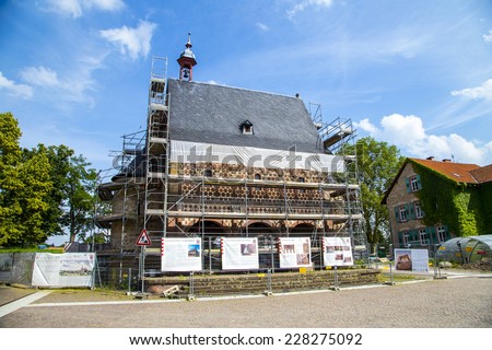 LORSCH, GERMANY - JULY 2, 2013: World culture heritage monastery Lorsch under construction in Lorsch, Germany. The Gate is renovated by the government of Hesse.