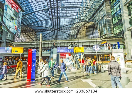 BERLIN, GERMANY - NOV 27, 2014: People inside the Berlin Central train station in Berlin, Germany. It is the is the main railway station in Berlin with a surface area of 85x120 mt.