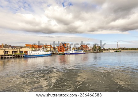 WOLGAST, GERMANY - APRIL 15, 2014: view to riverside of old village of Wolgast, Germany. The peene river at Wolgast is deep enough to serve the dockyards in Wolgast.