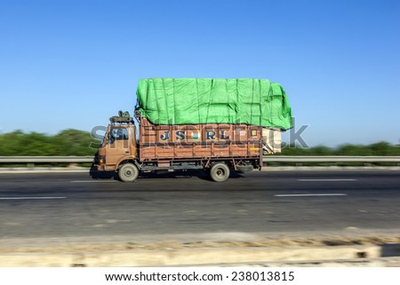 JEWAR BANGER, INDIA - NOV 12, 2011: truck uses the YAmuna express way in Jewar Banger, India. The Highway is a toll road and was finally inaugurated at August 2011.
