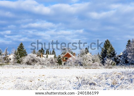 snow covered fields with settlement at the horizon in Munich,Germany