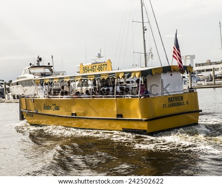 FORT LAUDERDALE, USA - AUGUST 20, 2014 : people travel in Water taxi in Fort Lauderdale, USA. Water taxi is popular by local people as well as by tourists.