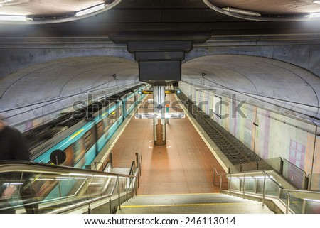 FRANKFURT, GERMANY - JAN 21, 2015: people wait at the metro station for the arriving train in Frankfurt, Germany. The Metro station was inaugurated 1978 after 8 years under construction.