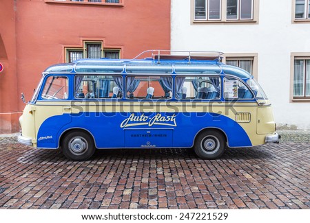 FREIBURG, GERMANY - JULY 29, 2014: famous old bus type SETRA S6 from 1953 transports people to touristic evvents in Freiburg, Germany.