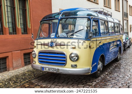 FREIBURG, GERMANY - JULY 29, 2014: famous old bus type SETRA S6 from 1953 transports people to touristic evvents in Freiburg, Germany.