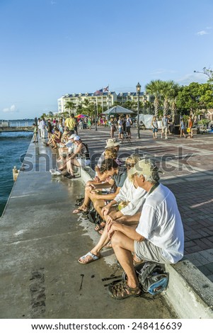 KEY WEST, USA - AUG 26, 2014: people enjoy the sunset point at Mallory square in Key West, USA. This place is the most popular sunset point in Key West.