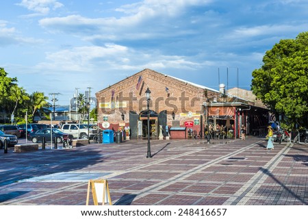 KEY WEST, USA - AUG 26, 2014: people visit old market building at Mallory square in Key West, USA. This place is the most popular sunset point in Key West.