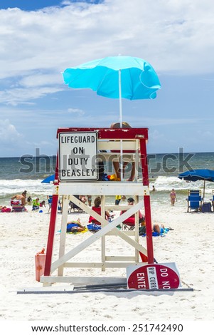 NICEVILLE, USA - JULY 21, 2013: people enjoy the beautiful beach at Niceville, USA. The adjacent cities of Niceville and Valparaiso, both built around Boggy Bayou, are known as the Twin Cities.
