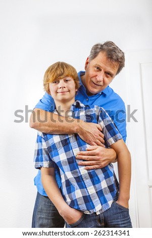 happy father and son hugging at home