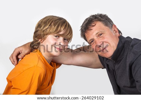 father and son hugging the other