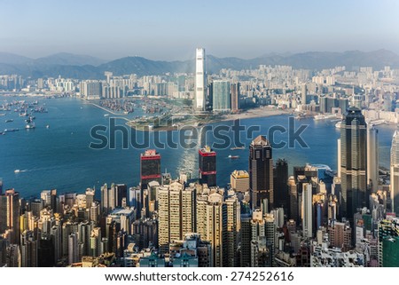 VICTORIA, HONGKONG - JAN 9, 2010: Hong Kong view from Victoria Peak to the bay and the skyscraper in sunset in Victoria, Hongkong.