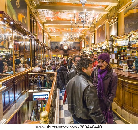 LISBON, PORTUGAL - DEC 27, 2008: people enjoy the Cafe A Brasileira in Lisbon, Portugal. The Cafe  is one of the oldest and most famous cafes in the old quarter of Lisbon.