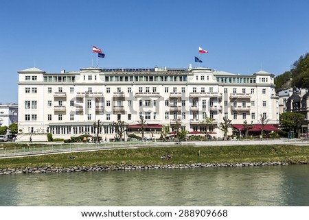 SALZBURG, AUSTRIA - APR 21, 2015: Hotel Sacher at Salzach river in Salzburg, Austria. The hotel was built between 1863 to 1866 by the hotelier and master builder Carl Freiherr.