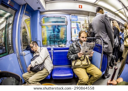 PARIS , FRANCE- JUNE 10, 2015: Tourists and locals on a subway train Line 8 in Paris, France. More than 30 million people visit Paris annually.