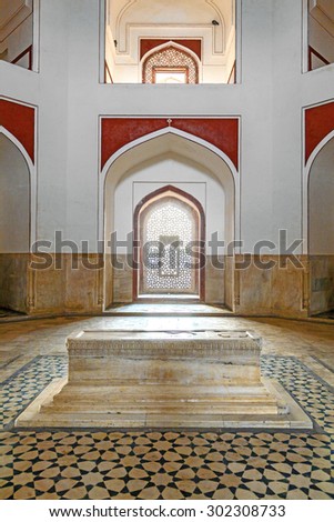 DELHI, INDIA - NOVEMBER 15, 2011: marble tomb inside  Humayuns tomb in Delhi, India. The tomb was commissioned by Humayun\'s first wife Bega Begum in 1569.