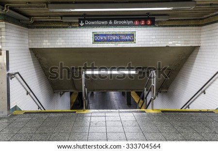 New York, USA - OCT 22, 2015: old vintage sign down town trains at Subway Station in Brooklyn. Another modern sign shows way to red lines downtown and Brooklyn.