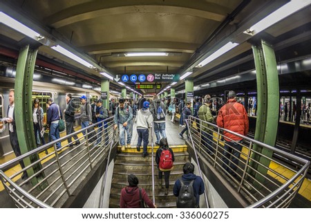 NEW YORK, USA - OCT 21 2015: People wait at subway station times square in New York. With 1.75 billion annual ridership, NYC Subway is the 7th busiest metro system in the world.